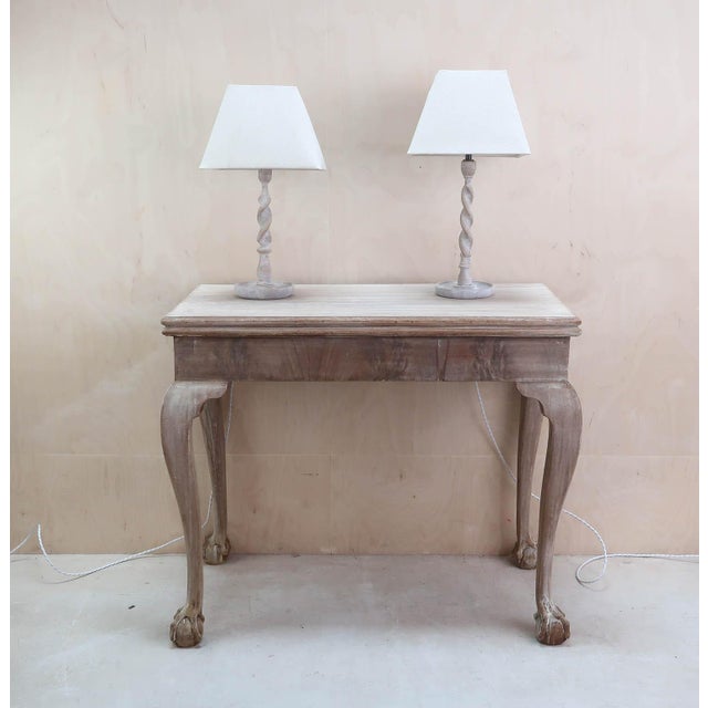 Near pair of limed oak barley twist table lamps. English. Early 20th century. One is slightly taller. The measurement...