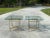 Hollywood Regency Chrome and Brass Side Tables Styled After Maison Jansen- a Pair. These tables feature chrome and brass...
