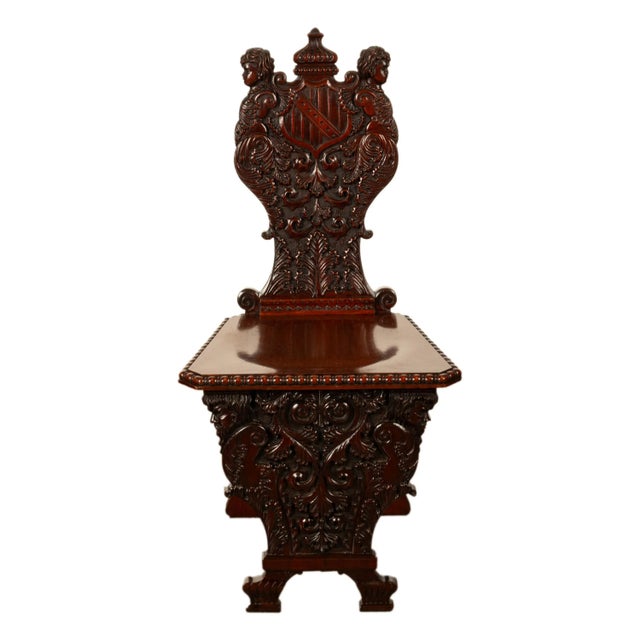 A fine carved antique Italian walnut Sgabello Renaissance Revival side chair, circa 1870. The chair is very finely carved,...
