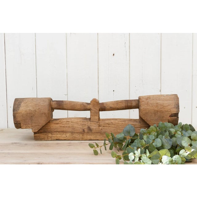 A rustic decor element, originally on axle of a cartwheel in Thailand. This antique teak fragment will be a lovely table...