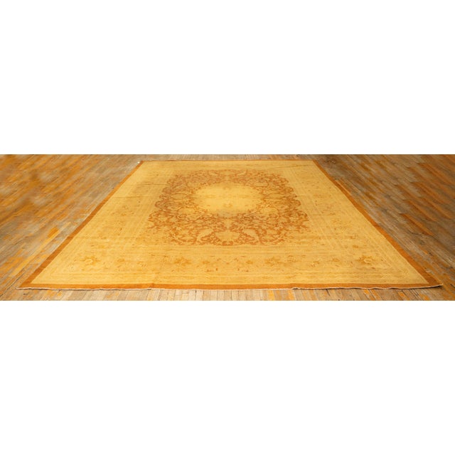 This handcrafted Agra rug reflects the refined, historically rich weaving traditions of North India. It features a...
