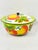 Large colorful vintage mid-century enamelware fruit-patterned serving bowl with a lid, commonly referred to by collectors...