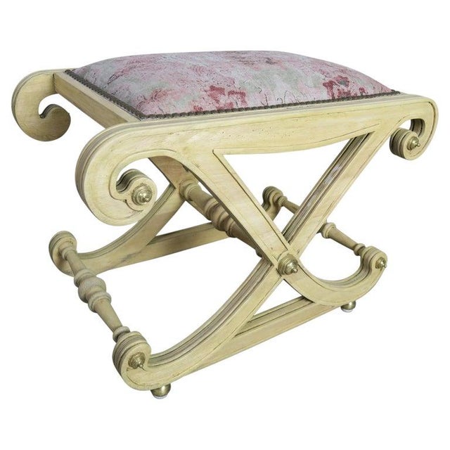 Italian style "X" bench in a bleached walnut finish with brass knob details throughout. The bench is newly reupholstered...