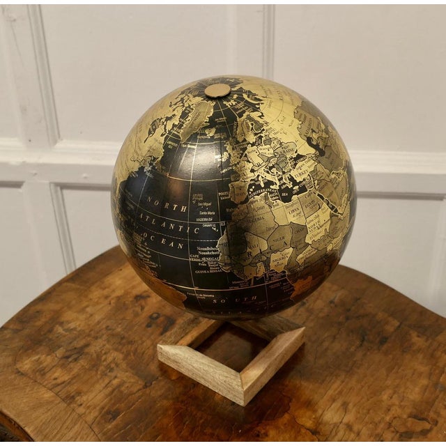 Mid Century 12” Terrestrial Black and Gold Globe This is an unusual colour presentation for a globe, this is a Mid Century...