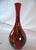 A striking and substantial 14.5-inch hand-blown art glass vase. This piece features a translucent ruby red body accented...