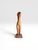 A striking vintage hand-carved wood sculpture depicting a stylized female nude figure. Beautifully executed in a warm...
