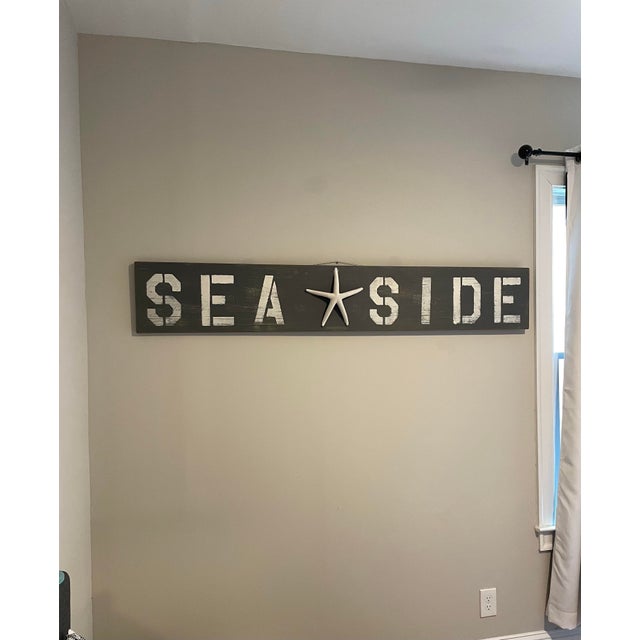This vintage hand-painted SEA★SIDE wall sign is a one-of-a-kind nautical decorative piece crafted from a reclaimed solid...