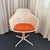This is a classic Model 116 Tulip Swivel Armchair, designed in the 1960s by Maurice Burke for the British manufacturer...