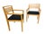 A stylish pair of vintage Knoll solid wood arm chairs dating to the 1990s. These beautifully constructed chairs feature...