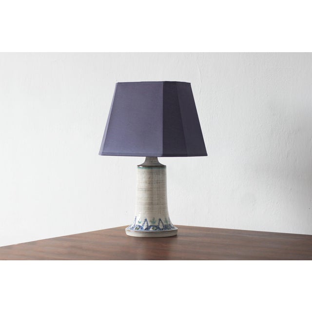 This ceramic lamp, produced by Søholm, is a unique piece from the Danish Modernist era, where the serene, organic...