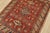 A tribal Caucasian Kazak rug hand-knotted with fine wool on a cotton foundation. This rug features a central medallion...
