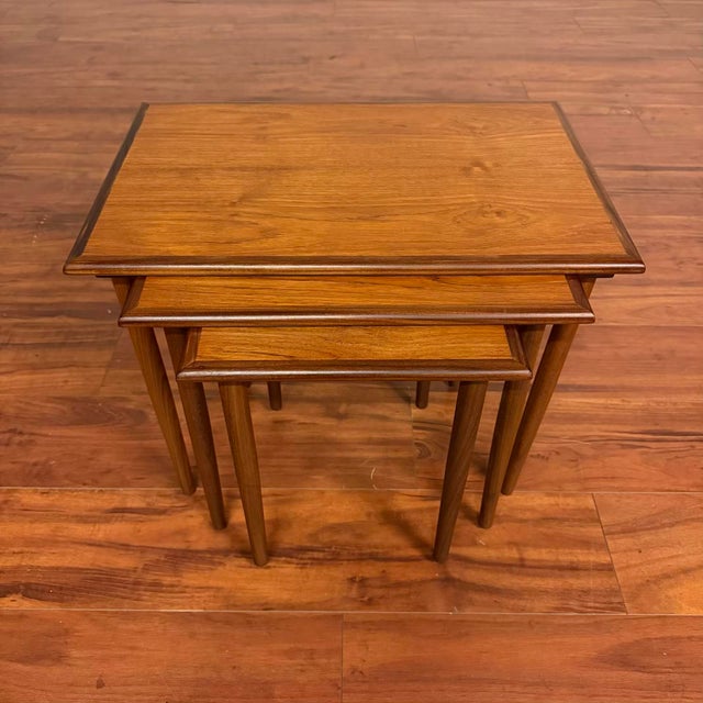 Danish modern set of three vintage teak nesting tables, made in Scandinavia circa 1960's. This set can be used every day...