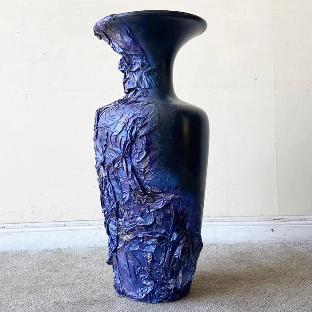 Exceptional postmodern floor vase. Features a black finish with a blue and purple paper mache around the side.