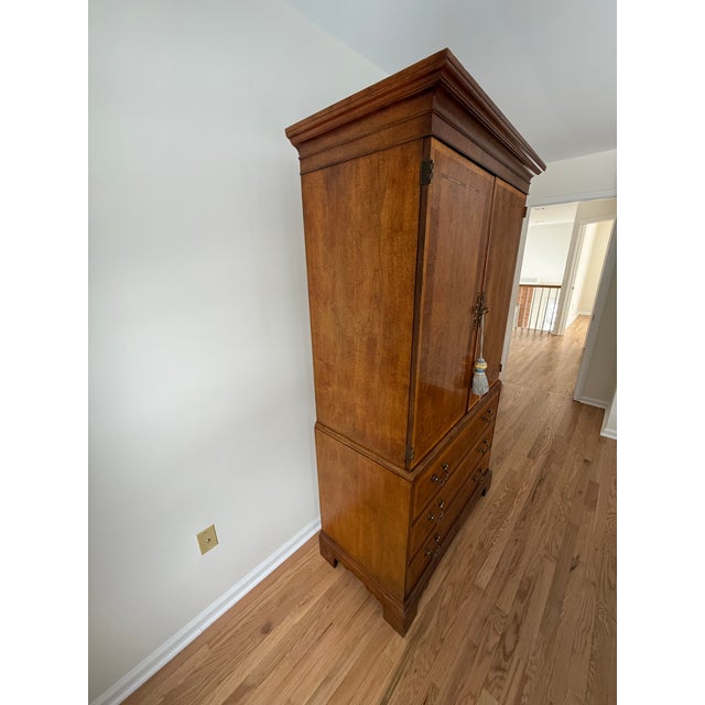 Immpressive, high-quality piece made of solid walnut with beautiful inlay and rich sheen finish. Interior cabinet is large...