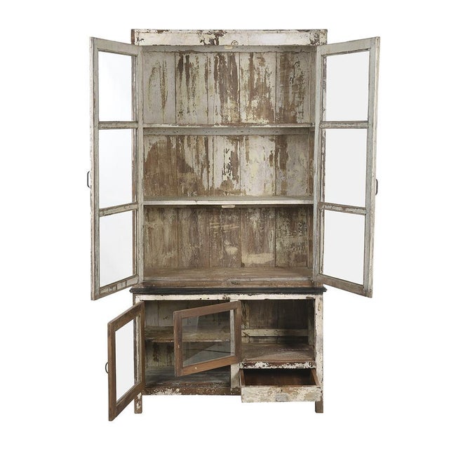 Large old wooden dresser (old teak) patinated. This piece is designed in the style of the selected designer and/or...