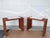 A pair of Scandinavian Modern benches or ottomans, hand-crafted from slatted pine wood with a warm brown finish. The open-...