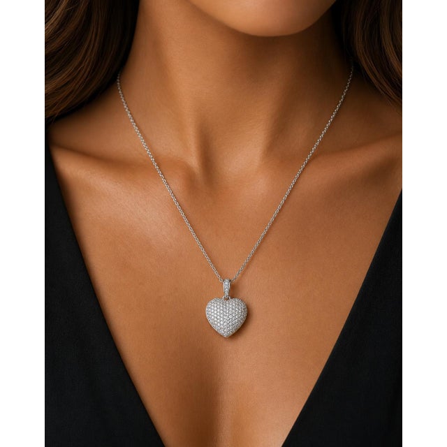 Platinum Heart Pendant with round white diamonds weighing approximately 2.50 carats. 18.12g