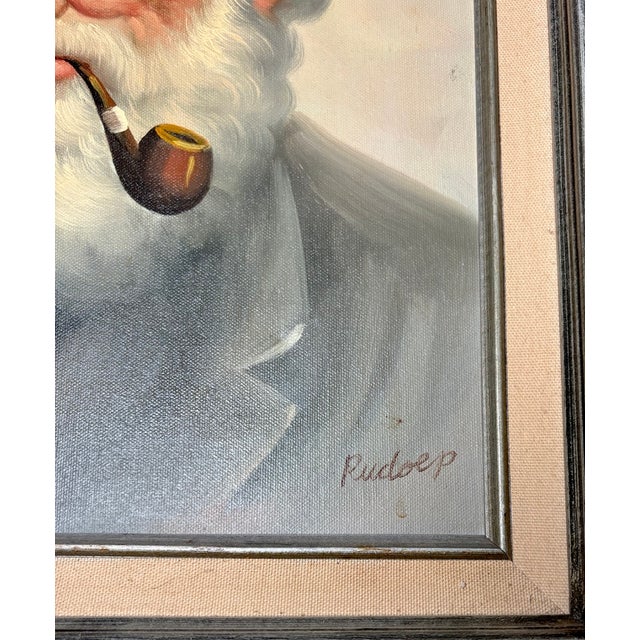 Framed mid-century oil on canvas portrait of a bearded sea captain wearing a traditional white captain’s cap and smoking a...