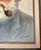 Framed mid-century oil on canvas portrait of a bearded sea captain wearing a traditional white captain’s cap and smoking a...