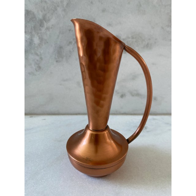 Vintage hammered copper 7" ewer pitcher or bud vase. Etched Gregorian on the bottom with a sticker that says "Solid Copper...