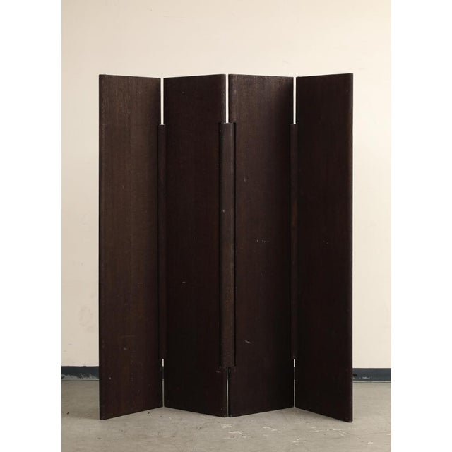 Four-panel sandblasted dark brown oak "Pivot" screen or room divider by Rabih Hage (French, b. 1966). 20th century. Each...