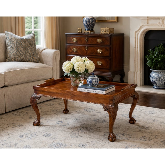 I wonderful wooden tray table from England circa 1940s. The claw foot cabriole legs make this English built table stand...