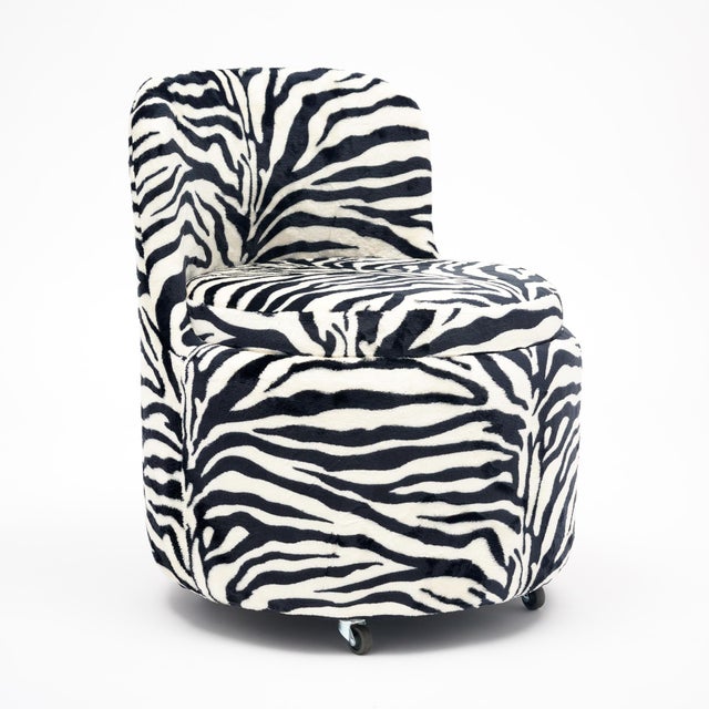 Vanity chair from 1970s France. This piece is supported on casters and features the original zebra striped upholstery. It...
