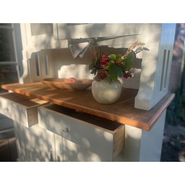 This charming antique kitchen sideboard has been given a fresh coat of paint. The top section was painted inside as well....