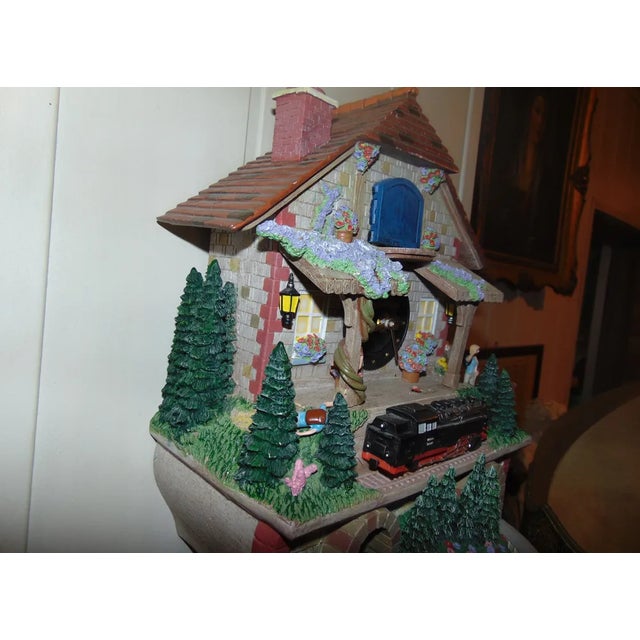 Clock, Bradford Exchange figure train, 1980s, dimensions: height 81 cm, width 25.5 cm, depth 14 cm.