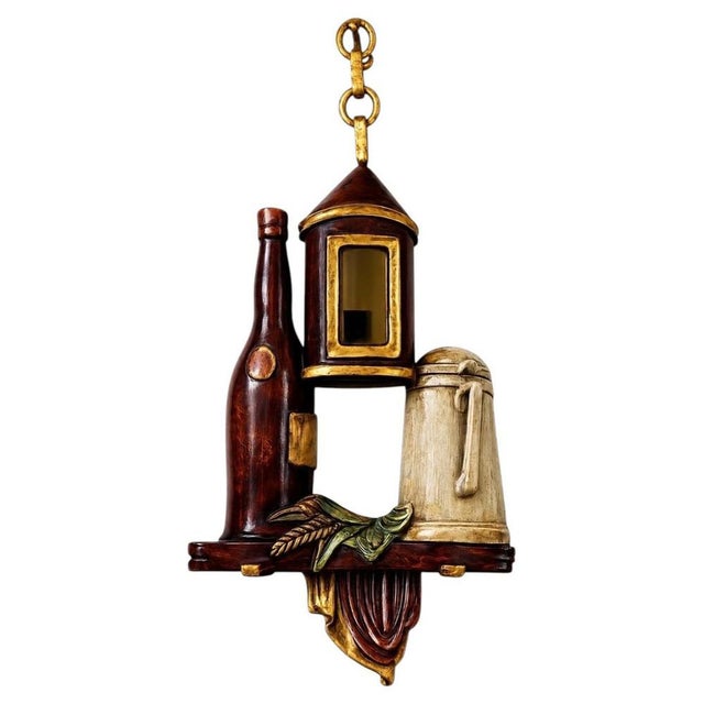 A remarkably rare and highly decorative Italian wall light from the 1960s, handcrafted in carved wood and featuring a...