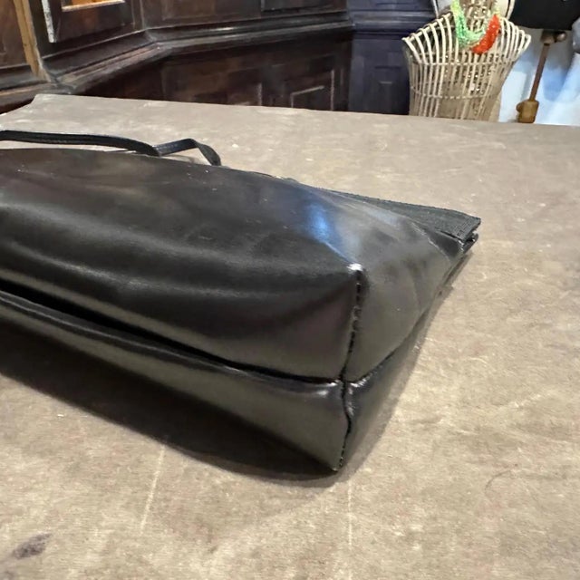 1990s Salvatore Ferragamo Black Leather and Brass Vara Shoulder Bag A timeless classic from the esteemed Italian house of...