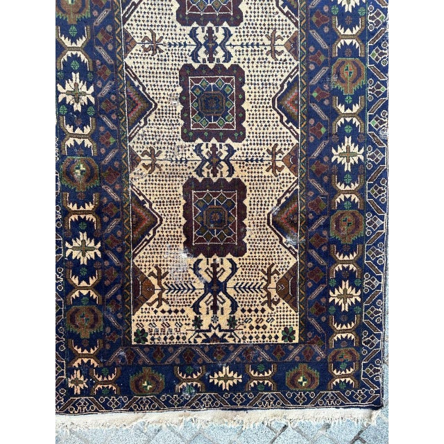 Pretty mid century distressed belutch rug from Afghanistan, with nice stylized design and beautiful colors with blue,...
