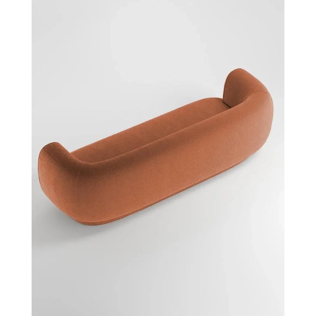 Hug sofa is defined by clean, simple lines and a distinctive armrest detail. The armrest, half overlapping the seat...