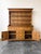 A striking antique English pine kitchen dresser/hutch with ample beautiful character. Comes apart in two pieces for easy...