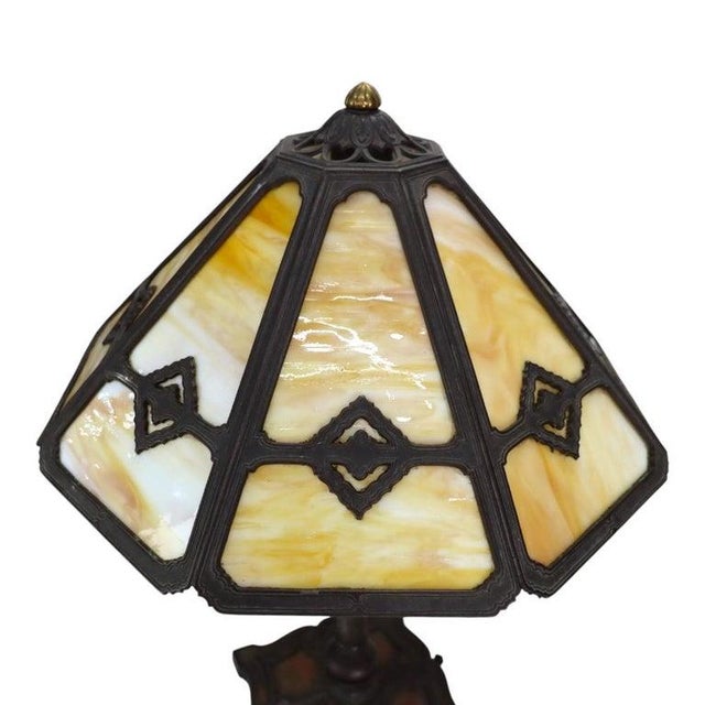 An antique Bradley & Hubbard Arts & Crafts table lamp, dating to approximately 1920. This lamp features an eight-panel...