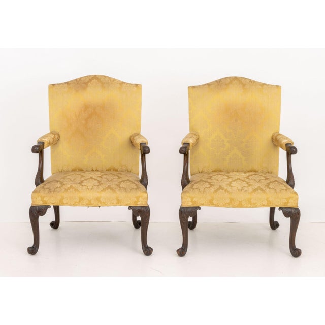 Pair of Late George II Mahogany Golden Silk Brocade Upholstered Armchairs, with carved foliate design to the arms and four...