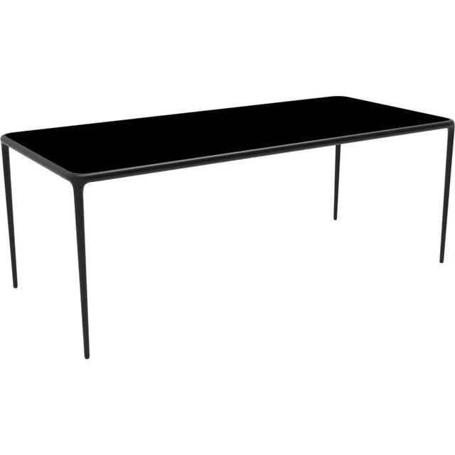 Xaloc chocolate glass top 200 table by mowee dimensions: d 200 x w 90 x h 74 cm material: aluminum, tinted tempered glass...