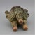 This distinctive ceramic incense burner is a captivating decorative piece, featuring a rich, textured tea-dust glaze in...