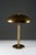 Elegant swedish grace table lamp executed in brass and bakelite, produced by nordiska kompaniet in the 1930s. The design...