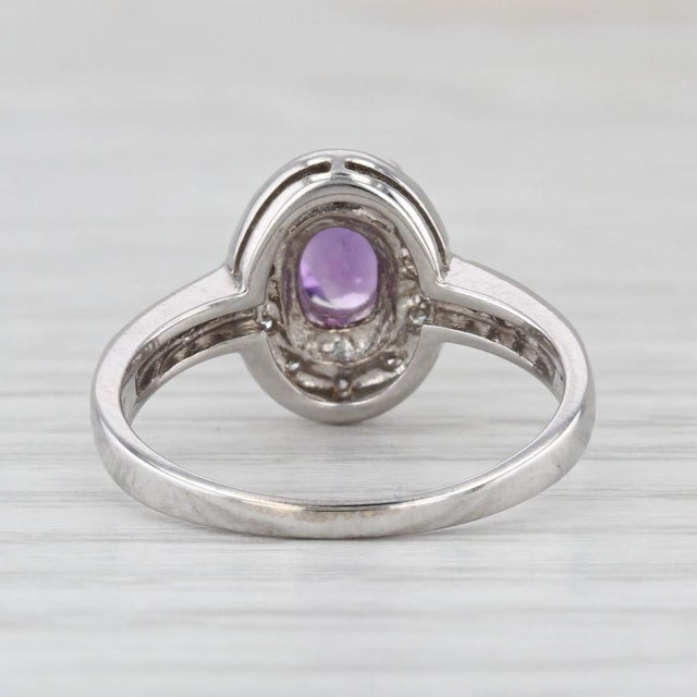 Gemstone Information: - Natural Amethyst - Carats - 0.60ct Cut - Oval Color - Purple - Natural Diamonds - Total Carats -...