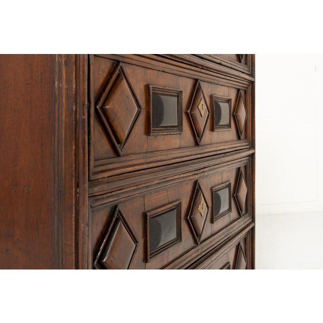 Early 18th century italian walnut chest of drawers an early 18th century italian walnut chest of four drawers. the chest...