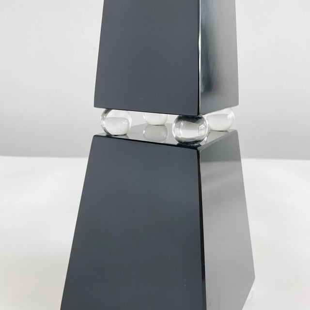 Exquisite glass Murano obelisk signed by master glass blower Romano Dona. Black Murano glass resting on transparent Murano...