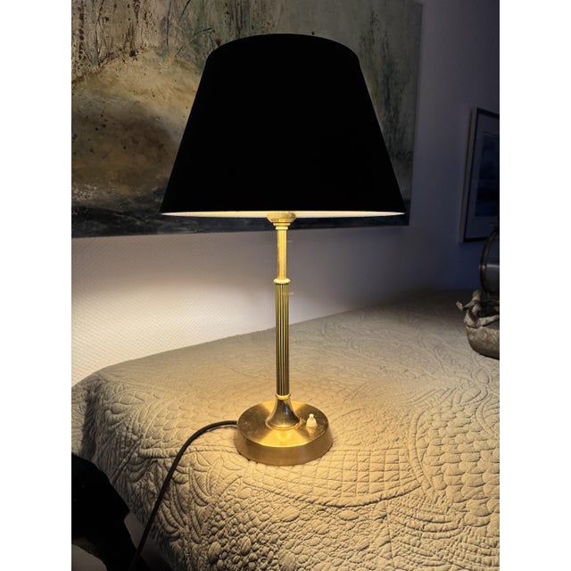 Mid-century table lamp model b70 by ewå värnamo, sweden, circa 1960. This elegant lamp features a slender brass-colored...