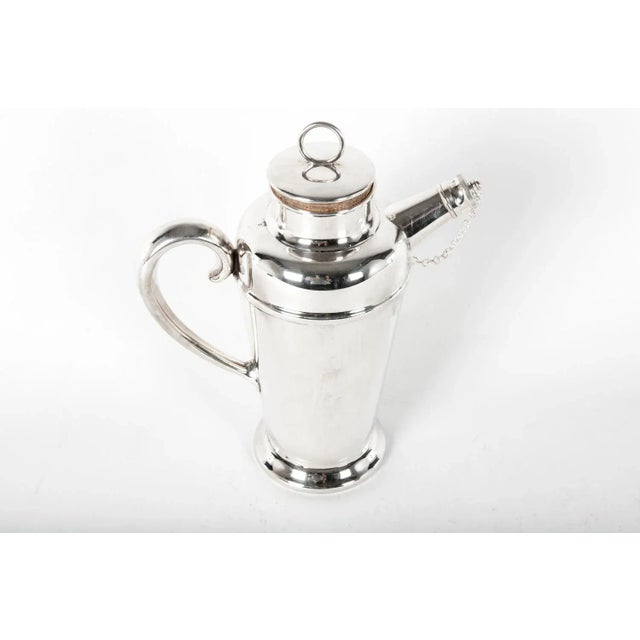 Vintage English silver plate cocktail shaker. This shaker would bring a great addition to any bar. The cocktail shaker...