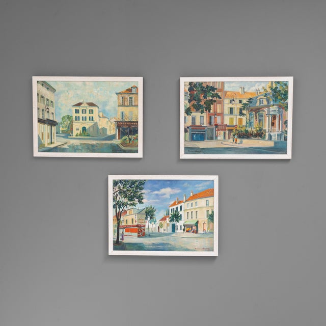 Set of three French village scene paintings. Circa 1970.