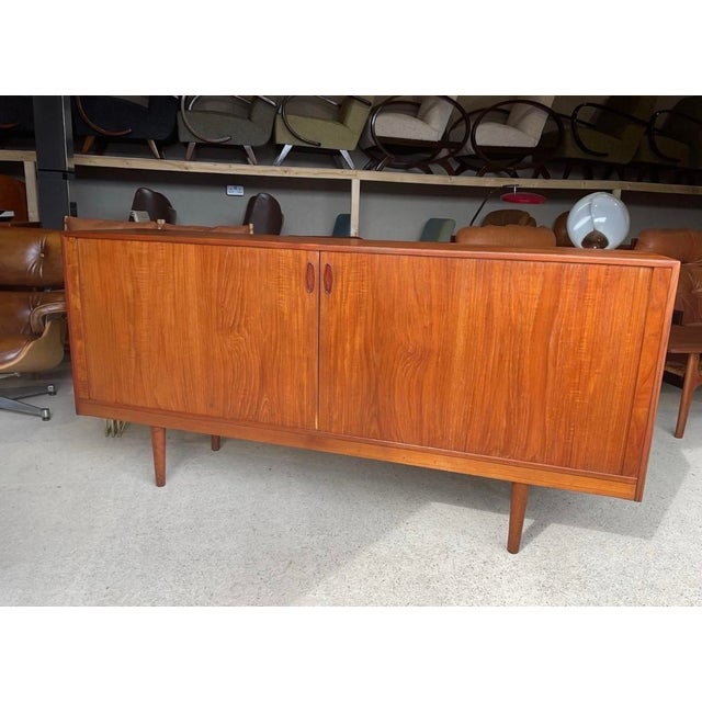Tambour sideboard in good used condition with small age related signs of use. Lots of storage space inside the unit yet it...