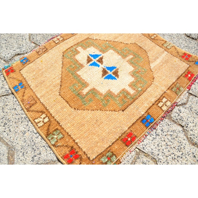 This is a vintage Turkish Oushak rug from the 1960s. The piece was hand-knotted.