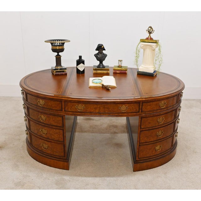 Gorgeous burr walnut oval partners desk in the Victorian manner This is a true partners desk with drawers on both sides so...