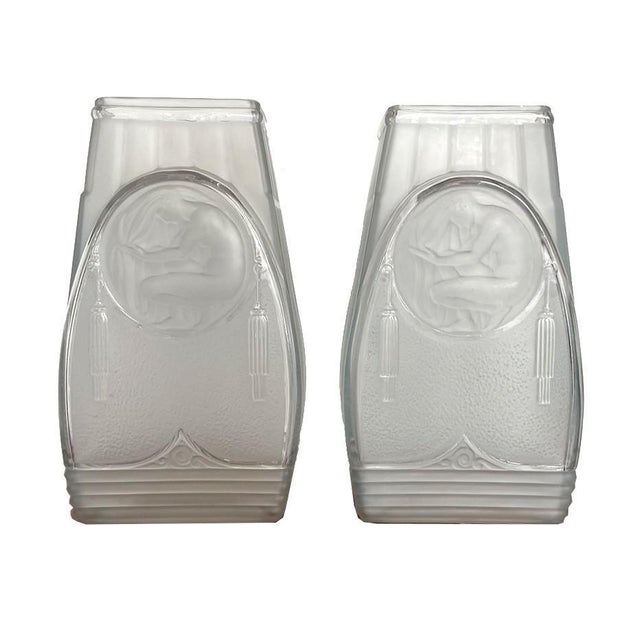 Pair of the Art Déco vases France around 1930 Wonderful state of preservation. Medallion on both sides of a kneeling...