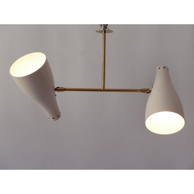 Extremely rare, elegant and articulated Mid-Century Modern two-armed sputnik ceiling fixture or pendant lamp. Adjustable...